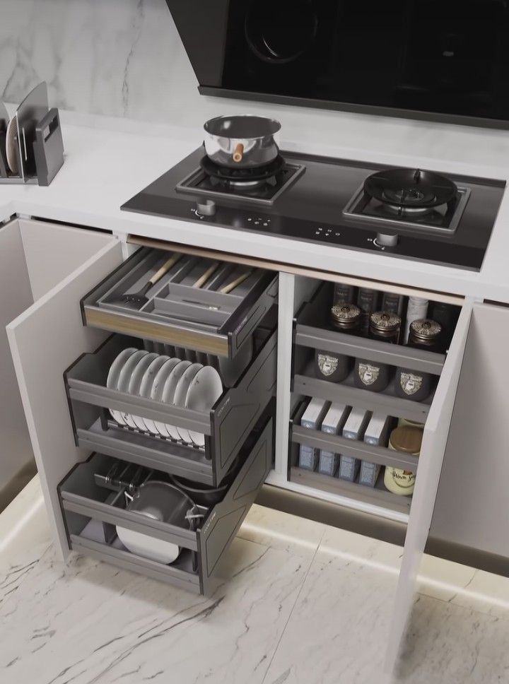 Ảnh chụp cận cảnh khu vực bếp tích hợp khay để xoong nồi thông minh, giải pháp tiết kiệm không gian bàn bếp.